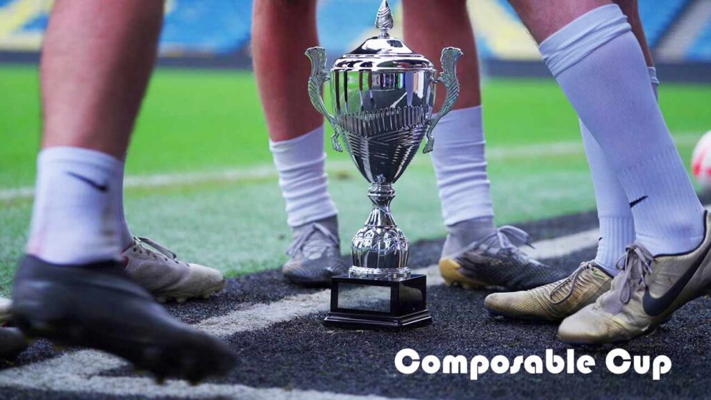 Men in football boots surrounding a trophy