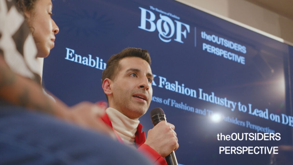 The Outsiders Perspective giving a talk on DEI